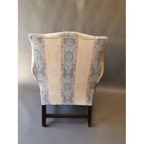 411 - Georgian mahogany and upholstered wing back arm chair on square legs {100 cm H x 79 cm W x 83 cm D}.