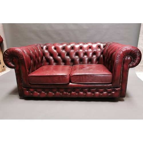 413 - Good quality oxblood leather deep buttoned two seater Chesterfield sofa {66 cm H x 161 cm W x 85 cm ... 
