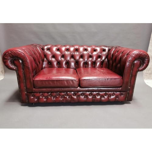414 - Good quality oxblood leather deep buttoned  two seater Chesterfield sofa {66 cm H x 161 cm W x 85 cm... 