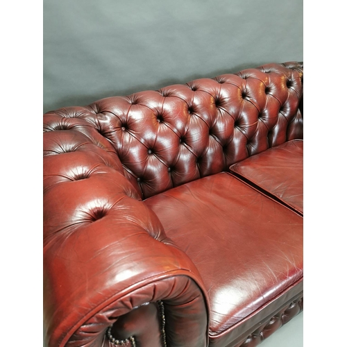 414 - Good quality oxblood leather deep buttoned  two seater Chesterfield sofa {66 cm H x 161 cm W x 85 cm... 