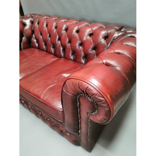 414 - Good quality oxblood leather deep buttoned  two seater Chesterfield sofa {66 cm H x 161 cm W x 85 cm... 