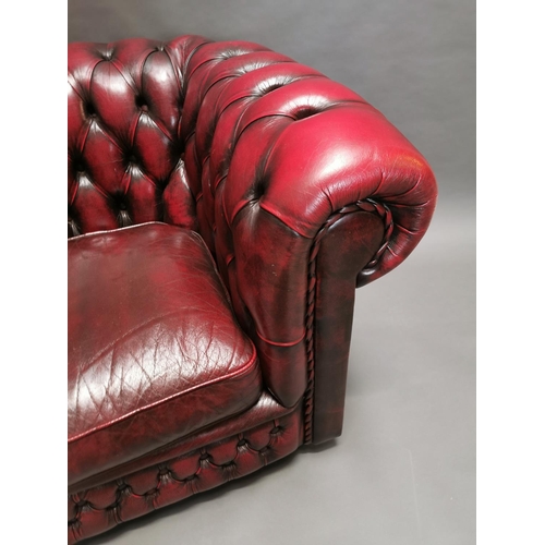 416 - Good quality oxblood leather deep buttoned Chesterfield club chair {77 cm H x 88 cm W x 86 cm D}.