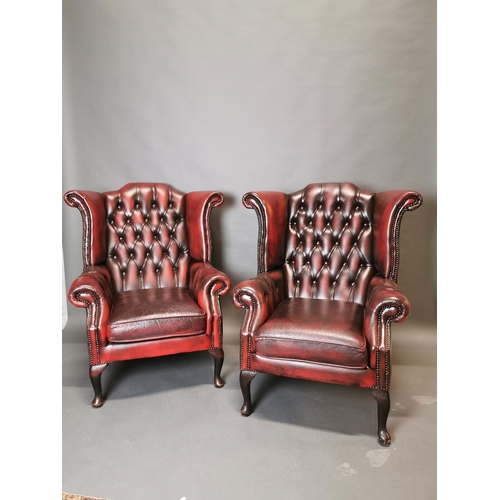 417 - Pair of good quality ox blood leather deep buttoned Chesterfield wing back arm chairs {113 cm H x 90... 
