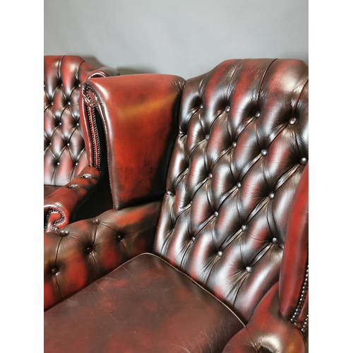 417 - Pair of good quality ox blood leather deep buttoned Chesterfield wing back arm chairs {113 cm H x 90... 