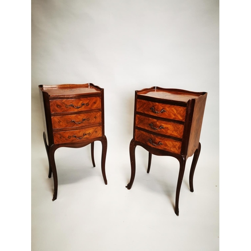423 - Pair of kingwood bedside lockers with three drawers on cabriole legs {71 cm H x 36 cm W x 30 cm D}.