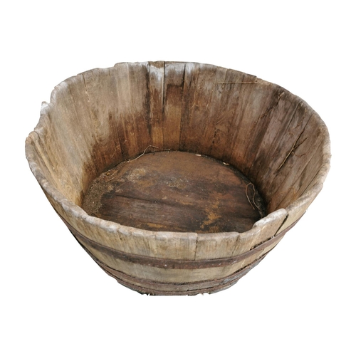 452A - Late 19th C. wooden and metal bound planter of large proportions {63 cm H x 109 cm Dia.}.