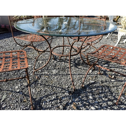 463 - Wrought iron garden table with glass top and four matching garden chairs {table is 69 cm H x 122 cm ... 