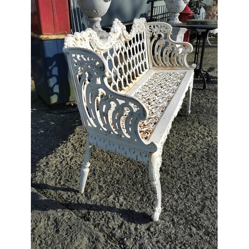 469 - Decorative cast iron three seater garden bench {91 cm H x 148 cm W x 52 cm D}.