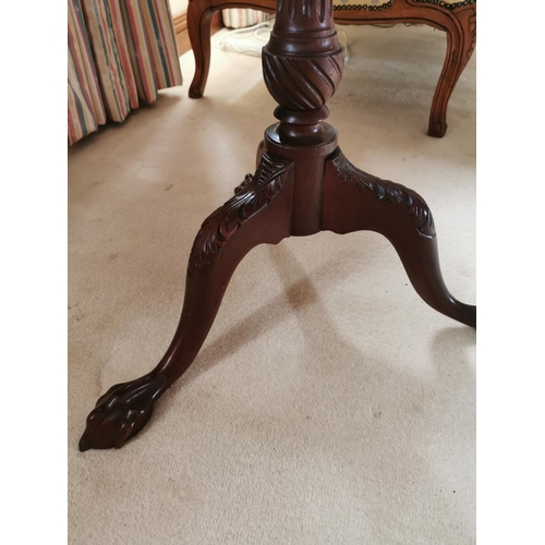 486 - Mahogany wine table, the pie crust top above a reeded column three outswept legs and claw and ball f... 