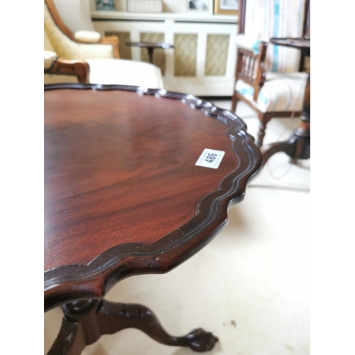 486 - Mahogany wine table, the pie crust top above a reeded column three outswept legs and claw and ball f... 