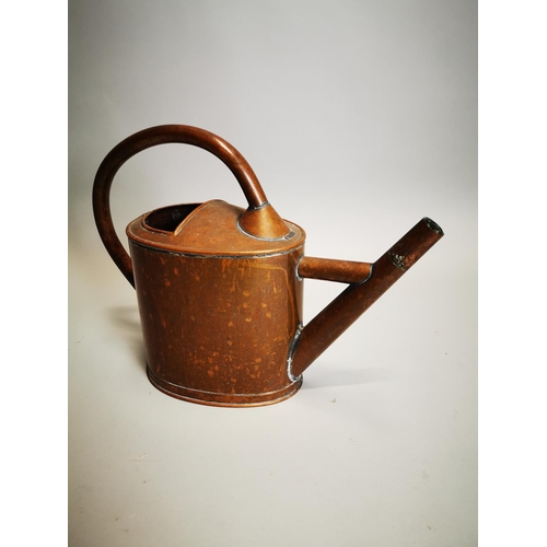 67 - 19th C. copper watering can {34 cm H x 45 cm W x 17 cm D}.