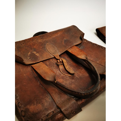 77 - Two early 20th C. leather bags {31 cm H x 41 cm W and 31 cm H x 39 cm W}.