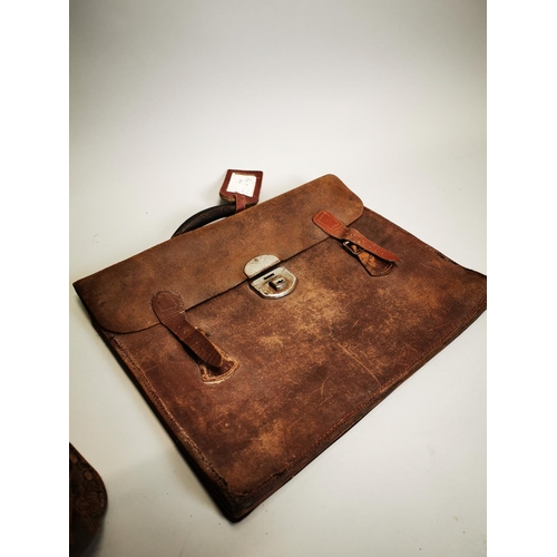 77 - Two early 20th C. leather bags {31 cm H x 41 cm W and 31 cm H x 39 cm W}.