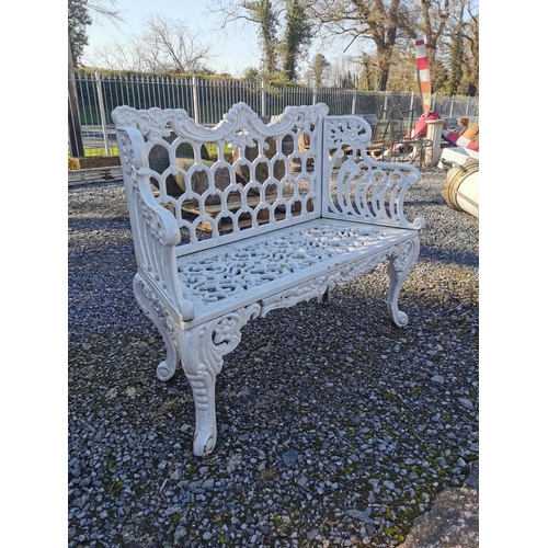 437 - Decorative cast iron two seater garden bench {88 cm H x 107 cm W x 47 cm D}.