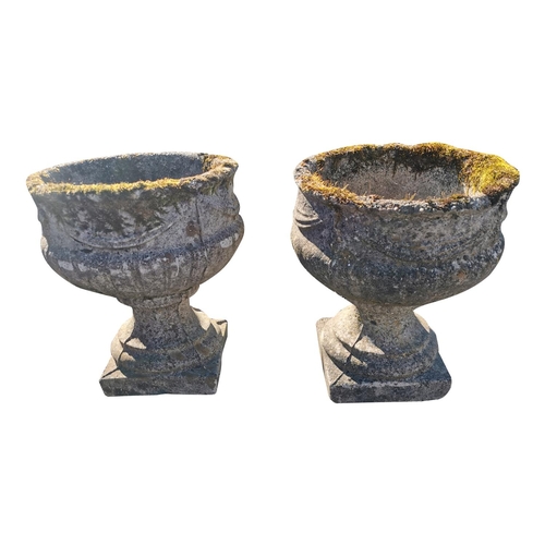 439 - Pair of early 20th C. composition urns {44 cm H x 36 cm Dia.}.