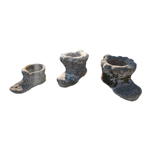 441 - Three 1970s composition planters in the form of boots.