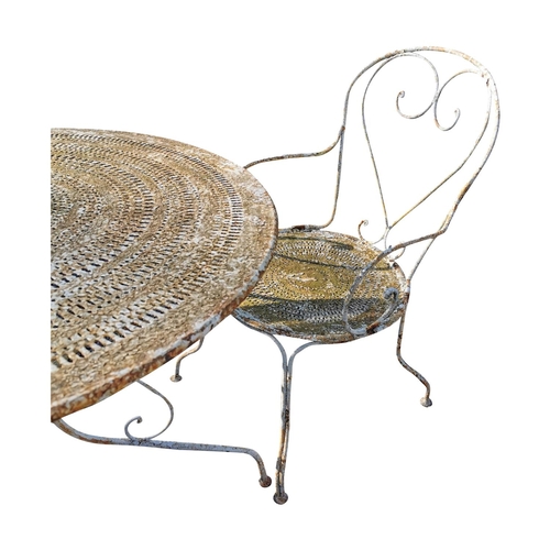 456 - Early 20th C. wrought iron garden table and four matching chairs {table is 71 cm H x 97 cm Dia and c... 