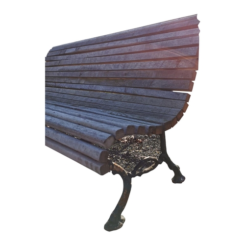 458 - Decorative cast iron and wooden garden bench {74 cm H x 140 cm W x 67 cm D}.