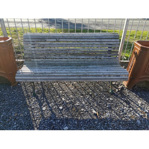 458 - Decorative cast iron and wooden garden bench {74 cm H x 140 cm W x 67 cm D}.