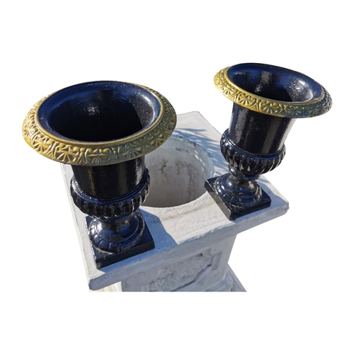 459 - Pair of decorative cast iron garden urns {33 cm H x 24 cm Dia.}.