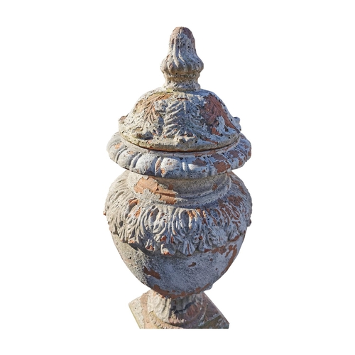 460 - Pair of glazed terracotta lidded urns in the Adam's style {82 cm H x 35 cm Dia.}.