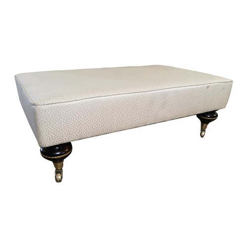 420A - Good quality mahogany and upholstered foot stool on ebonised turned legs and brass castors {74 cm H ... 