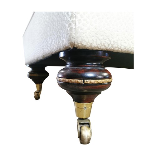 420A - Good quality mahogany and upholstered foot stool on ebonised turned legs and brass castors {74 cm H ... 
