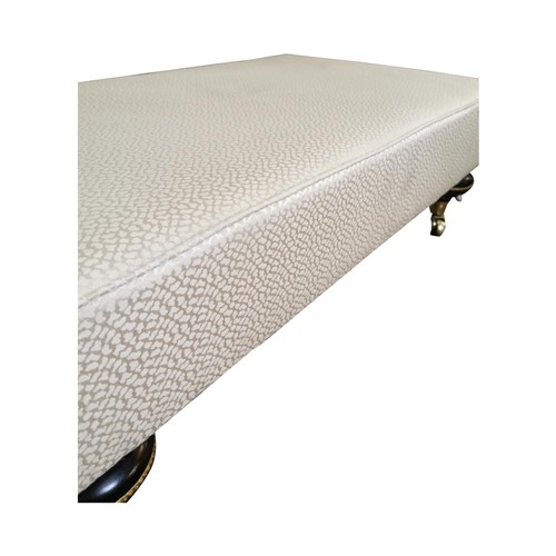 420A - Good quality mahogany and upholstered foot stool on ebonised turned legs and brass castors {74 cm H ... 