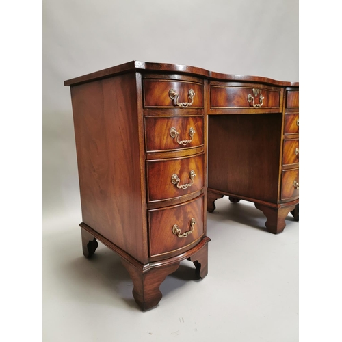 100 - Edwardian mahogany writing desk, with inset tooled leather top above a centre drawer flanked by eigh... 
