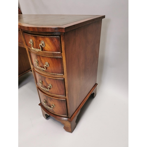 100 - Edwardian mahogany writing desk, with inset tooled leather top above a centre drawer flanked by eigh... 