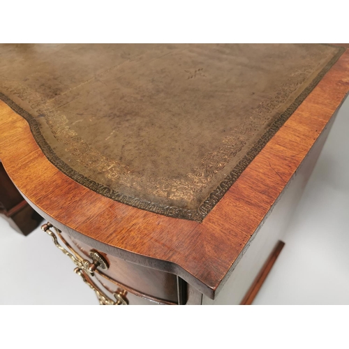 100 - Edwardian mahogany writing desk, with inset tooled leather top above a centre drawer flanked by eigh... 