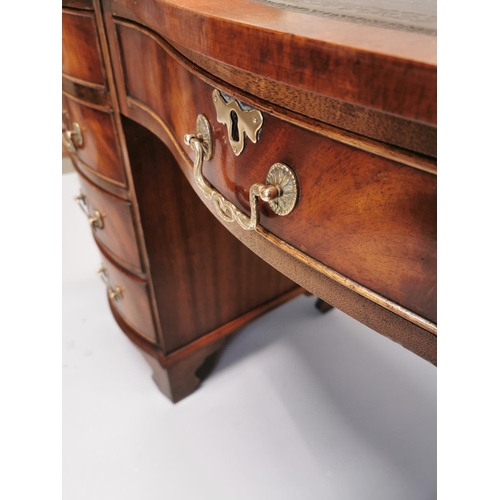 100 - Edwardian mahogany writing desk, with inset tooled leather top above a centre drawer flanked by eigh... 