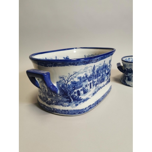 102 - Two blue and white ceramic foot baths { 21cm H X 45cm W X 30cm D & 14cm H X 34cm W X 22cm D }.