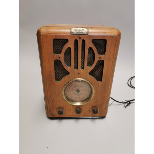 105 - Art Deco style radio. { 34cm H X 25cm W X 19cm D }.