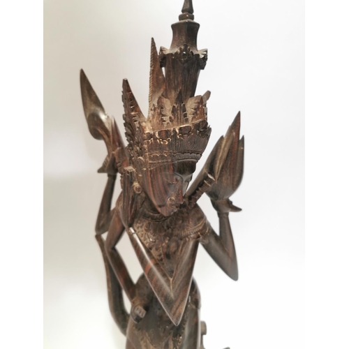 114 - Carved coromandel Oriental Deity . { 60cm H X 16cm W X 10cm D }.