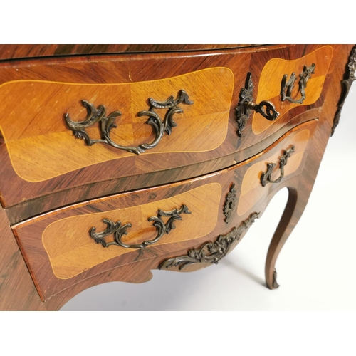 116 - Kingwood chest with metal mounts and two long drawers, raised on shaped legs. { 74cm H X 76cm W X 39... 