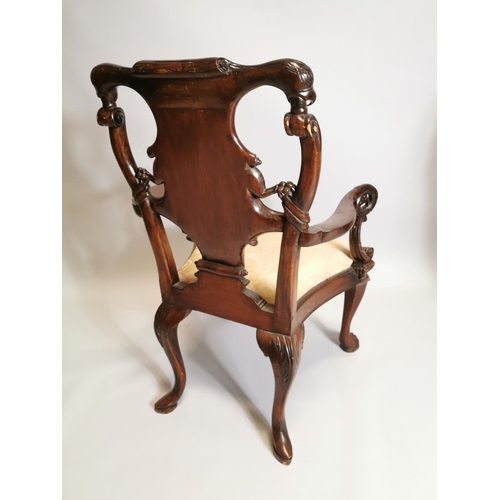 38 - Good quality carved mahogany open arm chair, decorated with Phoenix,  in the Irish Georgian manner{1... 