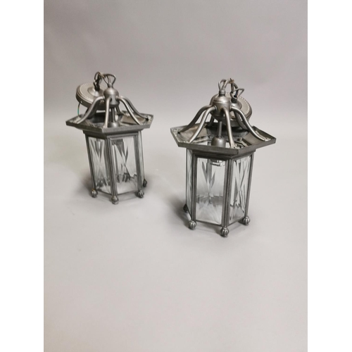 63 - Two metal lanterns { Each 45cm H X 20cm Dia }.