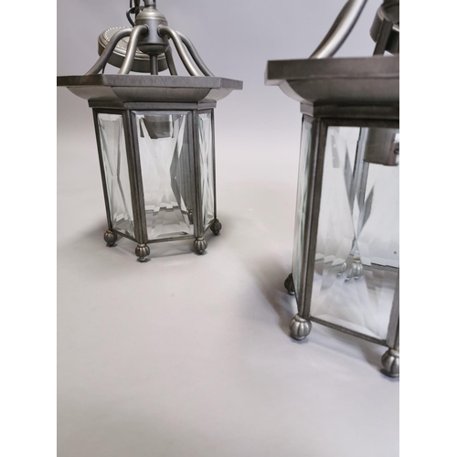 63 - Two metal lanterns { Each 45cm H X 20cm Dia }.