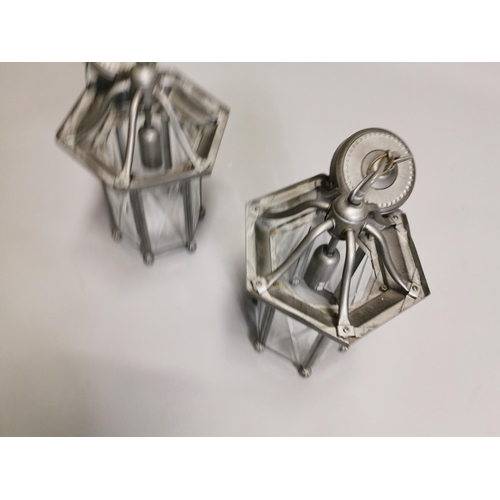 63 - Two metal lanterns { Each 45cm H X 20cm Dia }.