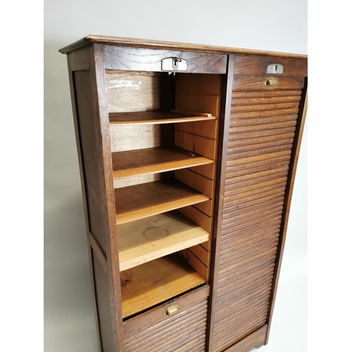 77 - Early 20th. C. oak filing cabinet, the tambour doors enclosed shelves. { 146cm H X 87cm W X 36cm D }... 