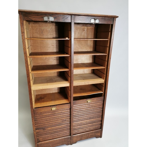 77 - Early 20th. C. oak filing cabinet, the tambour doors enclosed shelves. { 146cm H X 87cm W X 36cm D }... 