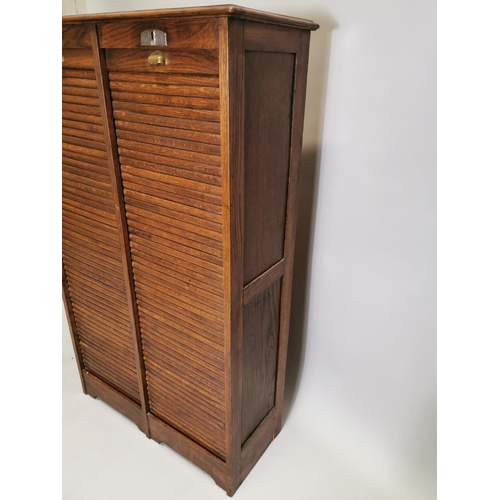 77 - Early 20th. C. oak filing cabinet, the tambour doors enclosed shelves. { 146cm H X 87cm W X 36cm D }... 