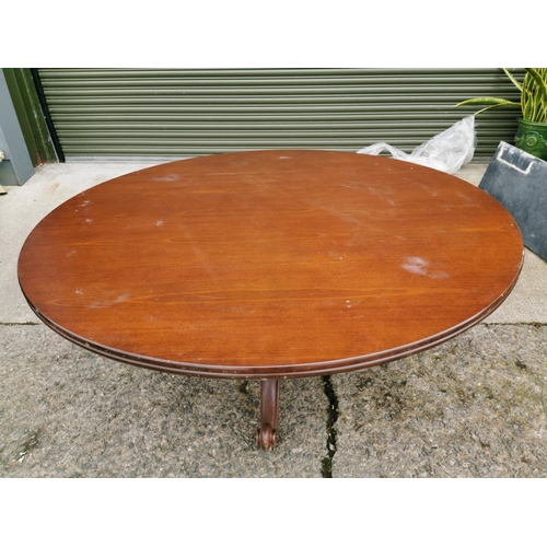 79 - Mahogany centre table raised on turned column and three out swept legs { 73cm H X 166 cm Dia }.