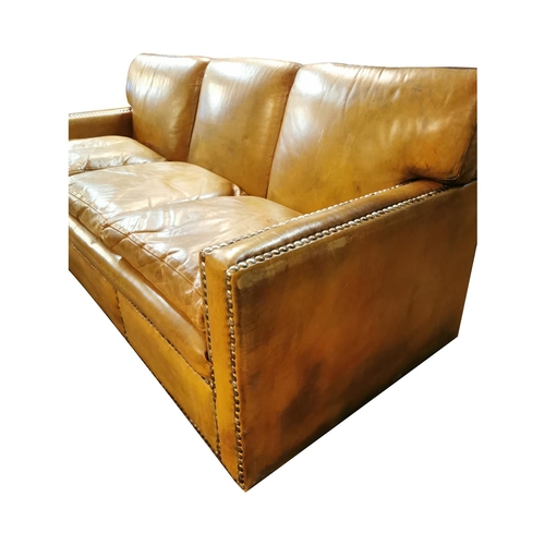 85 - Good quality three seater leather upholstered sofa { 85cm H X 204cm W X 91cm D }.
