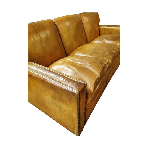 85 - Good quality three seater leather upholstered sofa { 85cm H X 204cm W X 91cm D }.