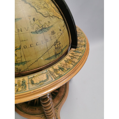 98 - Drinks' cabinet in the form of a globe on stand with fitted interior . { 103cm H X 80cm Dia }.