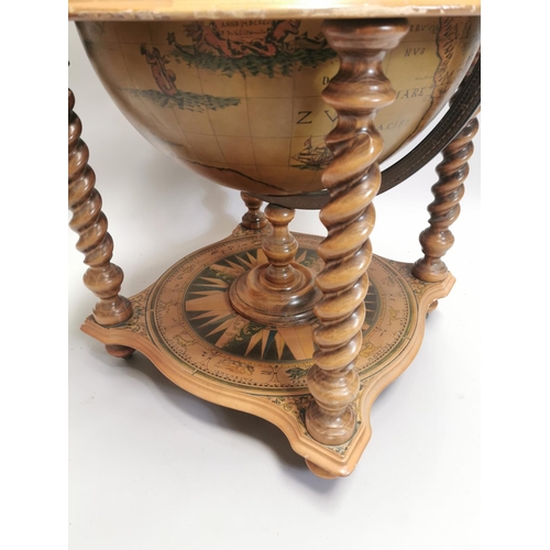 98 - Drinks' cabinet in the form of a globe on stand with fitted interior . { 103cm H X 80cm Dia }.