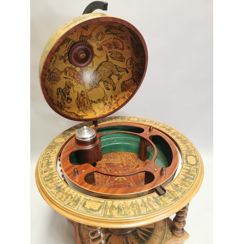 98 - Drinks' cabinet in the form of a globe on stand with fitted interior . { 103cm H X 80cm Dia }.