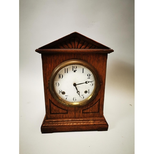 106 - Edwardian oak mantle clock with enamel dial. {36 cm h x 26 cm w x 12 cm D}.